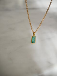 This tiny emerald necklace is the perfect daily necklace for emerald  lovers and May babies! The necklace is 14k gold filled with a beautiful natural Zambian Emerald pendant in a vivid green color in 18k solid gold setting. So beautiful! Layer it with your favorite necklaces, or wear it alone - it's perfect either way! Made using the highest quality USA and UK sourced materials. The pendant is very small, approximately 6.50x3.75mm. Each stone is unique and there will be slight variations in size, cut, inclusions and clouds.  Emerald💚 Through time, the emerald has been known as a symbol of truth and love. In ancient Greece and Rome, emerald was said to be the gemstone of the goddess Venus, purveyor of love and hope. On the other side of the world, emeralds were revered by the Incas and bel Gold Emerald Pendant Necklace For Everyday, Everyday Gold Emerald Pendant Necklace, Everyday Emerald Pendant Necklace, Minimalist Emerald Gemstone Necklace Gift, 14k Gold Emerald Pendant Necklace, Daily Necklace, Emerald Pendant Necklace, Green Pendant Necklace, Emerald Necklace Pendant