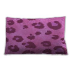 a purple and black animal print pillow on a white background