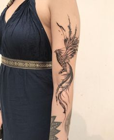 a woman with a tattoo on her arm