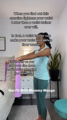 a woman standing in front of a bed holding a pink bag with the words get fit with mommy mango on it