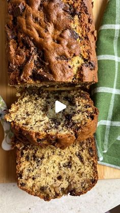 a loaf of banana bread sitting on top of a cutting board