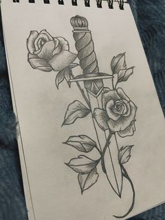 a pencil drawing of a dagger and roses