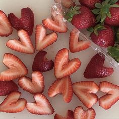 strawberries are arranged in the shape of hearts