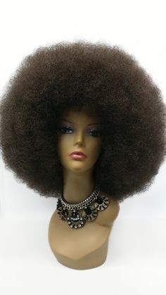 "A super jumbo size afro wig that packs plenty of volume and wow factor. Some styling may be required. Made with synthetic fibers. Color: Dark Brown (4) Circumference: Default at 21\" with adjustable cap (max 23\"). Materials: Synthetic Wig Fibers All sales are final. Please read all store policies before purchasing." Brown Afro, Bday Photoshoot, Afro Wig, Bouffant Hair, Afro Wigs, Costume Wigs, Synthetic Wig, Doll Hair, Afro Hairstyles