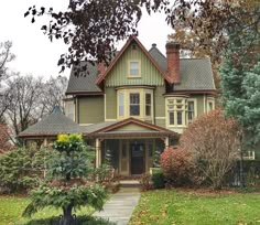 a large house with lots of trees in front of it