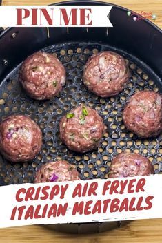 some meatballs are cooking in a frying pan on a table with a sign that says crispy air fryer italian meatballs