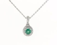 14K WHITE GOLD GREEN EMERALD AND DIAMOND FALLING EDGE HALO NECKLACE. Emerald Pendant Necklace Unique, Elegant Emerald Pendant Necklace, Elegant Emerald Pendant Necklace With Gemstone Accents, Exquisite Gold Emerald Pendant Necklace, Elegant Emerald Pendant Gemstones, Halo Necklace, Emerald Green