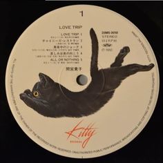 the label for kitty records, with an image of a cat on it's back