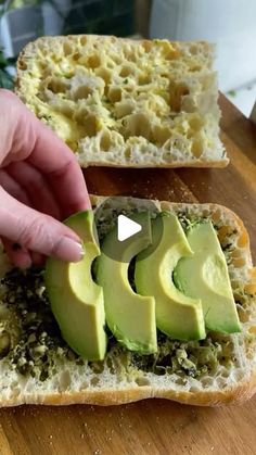 an avocado cut in half on top of bread