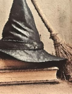 a painting of a witches hat on top of a book