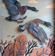 two birds are flying in the sky above some trees and leaves on a sheet of paper