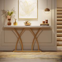 a console table with two vases on it and an art piece hanging above it