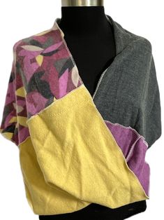 "Perfect for fall and winter! This beautiful piece is a cross between a scarf and a poncho...it pulls over the head like a poncho (but has a larger opening and won't mess up your hair), and it has a stylish twist in the front like a scarf. This warm wrap is made entirely from recycled wool sweaters. It can be worn as outerwear, or as a \"topper\" to complement your outfit. There is a point in the back and a twist in the front for visual interest.  Of course, it can be turned in any direction you Recycled Wool Sweater, Orchid Purple, Ladies Poncho, Wool Poncho, Mess Up, Fall And Winter, Wool Sweaters, Charcoal Grey, Shawl