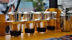 several shot glasses lined up on a table