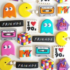 decorated cookies are arranged in the shape of cassettes and tape recorders, with words that spell out i love my friends