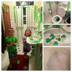 two children standing in front of a sink and toilet with green streamers on the walls