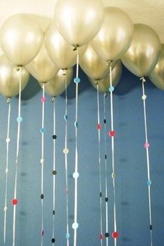 many balloons are hanging from the ceiling