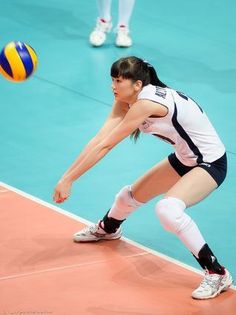 a female volleyball player prepares to serve the ball during a match against japan in tokyo, japan