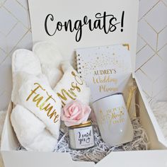 a gift box containing personal items for the bride and groom to have in their wedding day