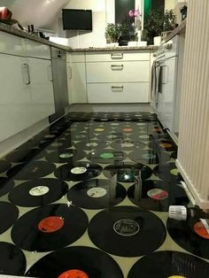 a kitchen with black and white polka dots on the floor