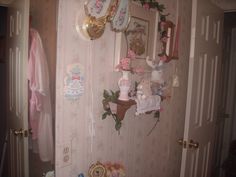 there are many items on the wall in this room that is decorated with pink and gold