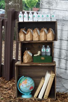 a wooden shelf filled with lots of items