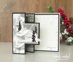 a christmas card with snow and trees on it