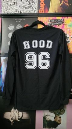 Choose your favorite band member to wear on this cute top! Last name and year in matte white vinyl on the back, and 5SOS name in white glitter on front left corner. Listing is shown in Hood/96 style. Available Styles for Back of Shirt:  -Clifford/95 -Irwin/94 -Hood/96 -Hemmings/96 -5SOS/11 *Long sleeve black tee in adult sizes.  *Garment brands may vary- I use products available to me at your time of purchase.  *Please send me a message with any questions or concerns. *All of my pieces are handm Winter Hip Hop T-shirt With Letter Print, 90s Style Tops For Fan Merchandise In Fall, Hip Hop Text Print Tops For Fall, 90s Long Sleeve Pre-shrunk Tops, 90s Style Long Sleeve Pre-shrunk Top, Hip Hop Letter Print Tops For College, Hip Hop Style Letter Print Tops For College, 90s White T-shirt For Winter, 90s Style White T-shirt For Winter