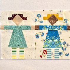 the block is made up of fabric and has different designs on it, including one girl