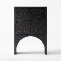 the sideboard is made from dark wood and has an arch at one end that extends into the floor