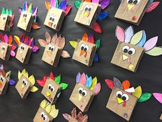 paper bags with turkeys on them are arranged in the shape of people's heads