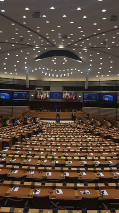 an empty conference room with rows of tables