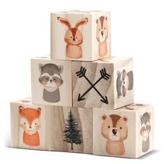 four wooden blocks with animals painted on them