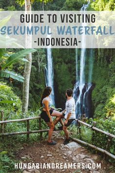 two people sitting on a railing looking at a waterfall with the words guide to visiting skempul water fall in indonesia