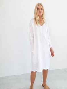 "FRIDA is a long sleeve linen dress with belt. DETAILS - Long sleeves - V neckline - Relaxed fit - Knee length - Self tie belt - Side seam pockets - 100% lightweight European linen fabric - Cut and sewn to order just for you in our studio COLOR - White, you can also choose other colors above - Fabric samples are available here https://www.etsy.com/listing/586569696/linen-fabric-samples SIZING & FIT - Relaxed fit - Length is approximately 38.5 inches / 98 cm - Bust is approximately 21 inches Summer V-neck Long Sleeve Dress For Daywear, V-neck Linen Dress For Workwear With Relaxed Fit, Relaxed Fit Linen V-neck Dress For Work, V-neck Linen Dress For Brunch, Summer V-neck Long Sleeve Work Dress, White Long Sleeve Summer Dress For Daywear, White Long Sleeve Dress For Summer Daywear, Fall Linen Midi Dress For Brunch, White Linen V-neck Midi Dress