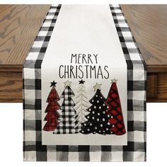 a christmas table runner with trees on it