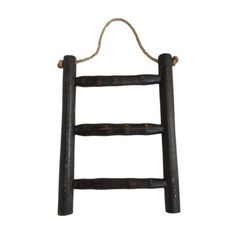 an old wooden ladder hanging from a rope