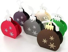 six christmas ornaments are shown in different colors