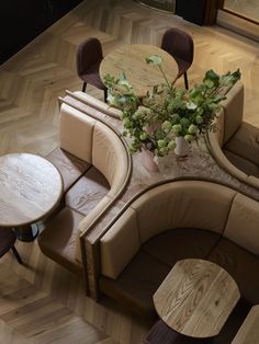 an overhead view of a living room with couches and tables