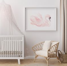 a baby's room with a white crib and pink flamingo painting