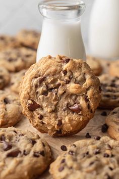 chocolate chip cookies next to a glass of milk