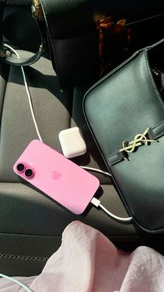 an iphone case is plugged into a charger in the back seat of a car