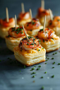 small appetizers with toothpicks in them on a tray, ready to be eaten