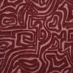 a red and white pattern on fabric