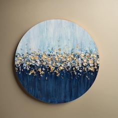 a blue and gold painting on a wall