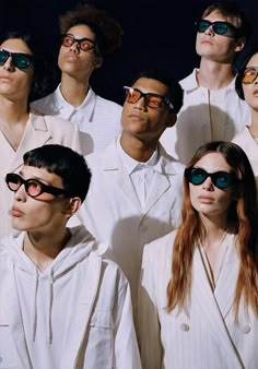 a group of men and women wearing sunglasses