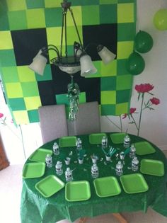 a table with green plates and cups on it