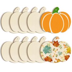 a bunch of pumpkin cutouts sitting next to each other