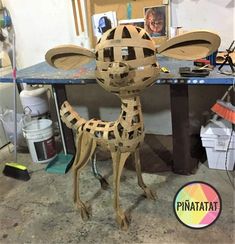 a sculpture of a giraffe made out of wood