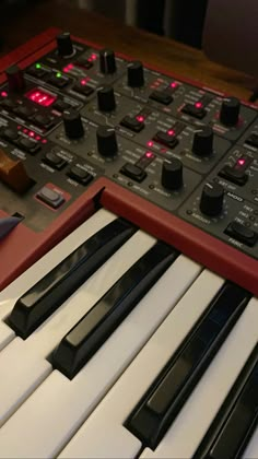 an electronic keyboard sitting on top of a table